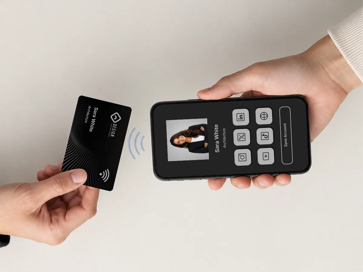 One person tapping their NFC business card against another person&rsquo;s smartphone to share their details